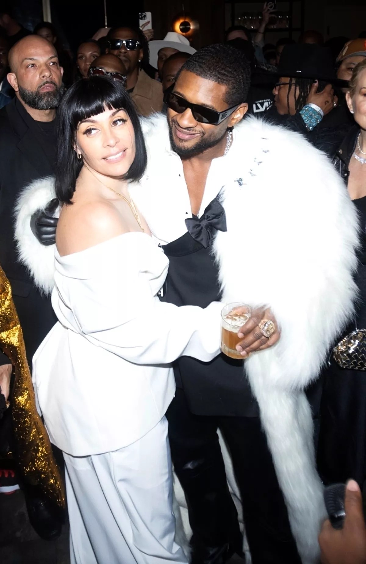 Usher and his new bride, Jennifer Goicoechea, make a stunning entrance at his private Super Bowl after party, directly following their wedding ceremony.